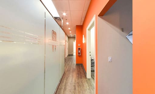 design-and-Build-sterling-dental-510x308 Dental office hallway with custom orange wall painting