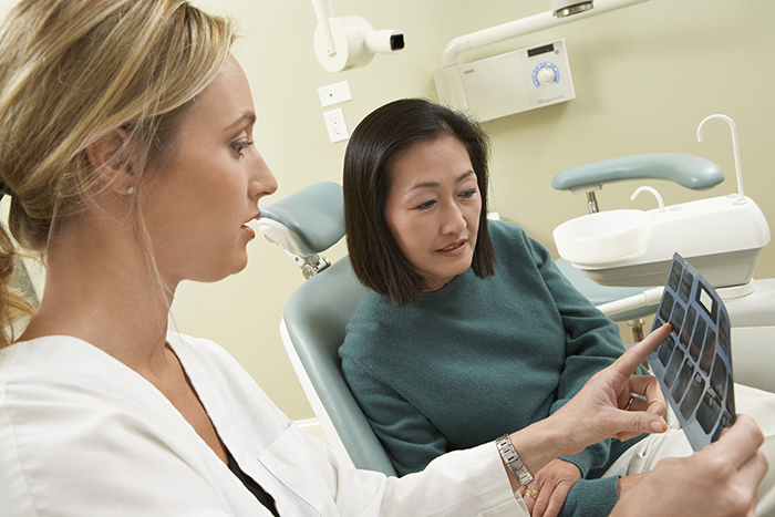 Lead Lining Dentist and patient in lead-lined X-ray room from dental office design & construction management